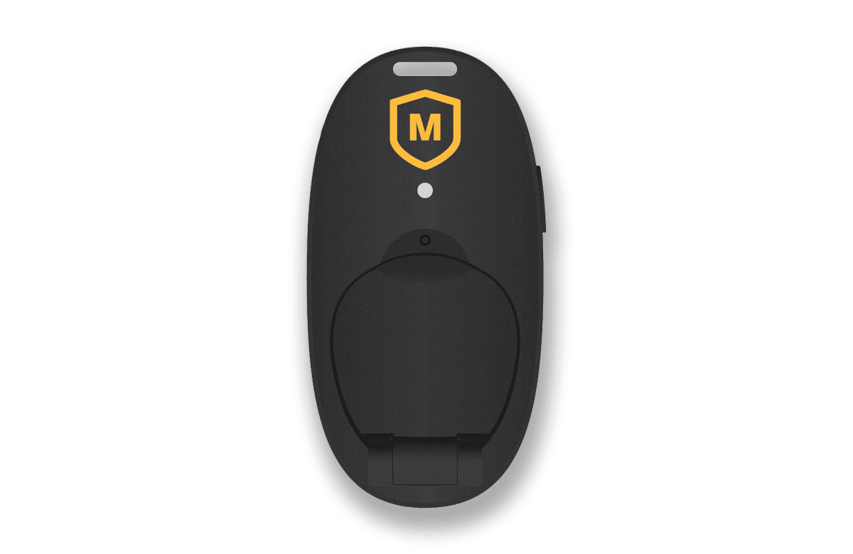 A MadeSafe employee safety device, also known as a personal location device (PLD). It resembles a key fob in shape and has a hole for a lanyard to easily attach so as to be carried by staff easily who can then activate in an emergency.
